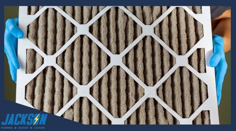 Person holds dirty filter