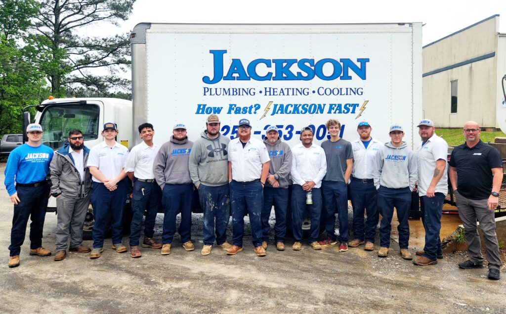 Jackson team in front of a service truck